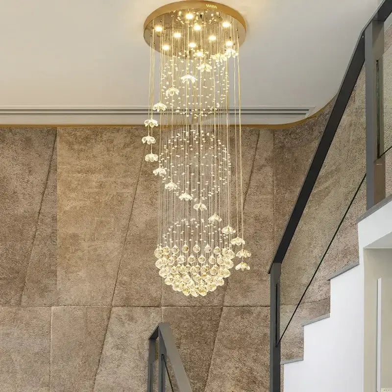 Modern multi-tiered gold-toned decorbites crystal hanging chandelier with cascading crystal droplets for staircase room decor