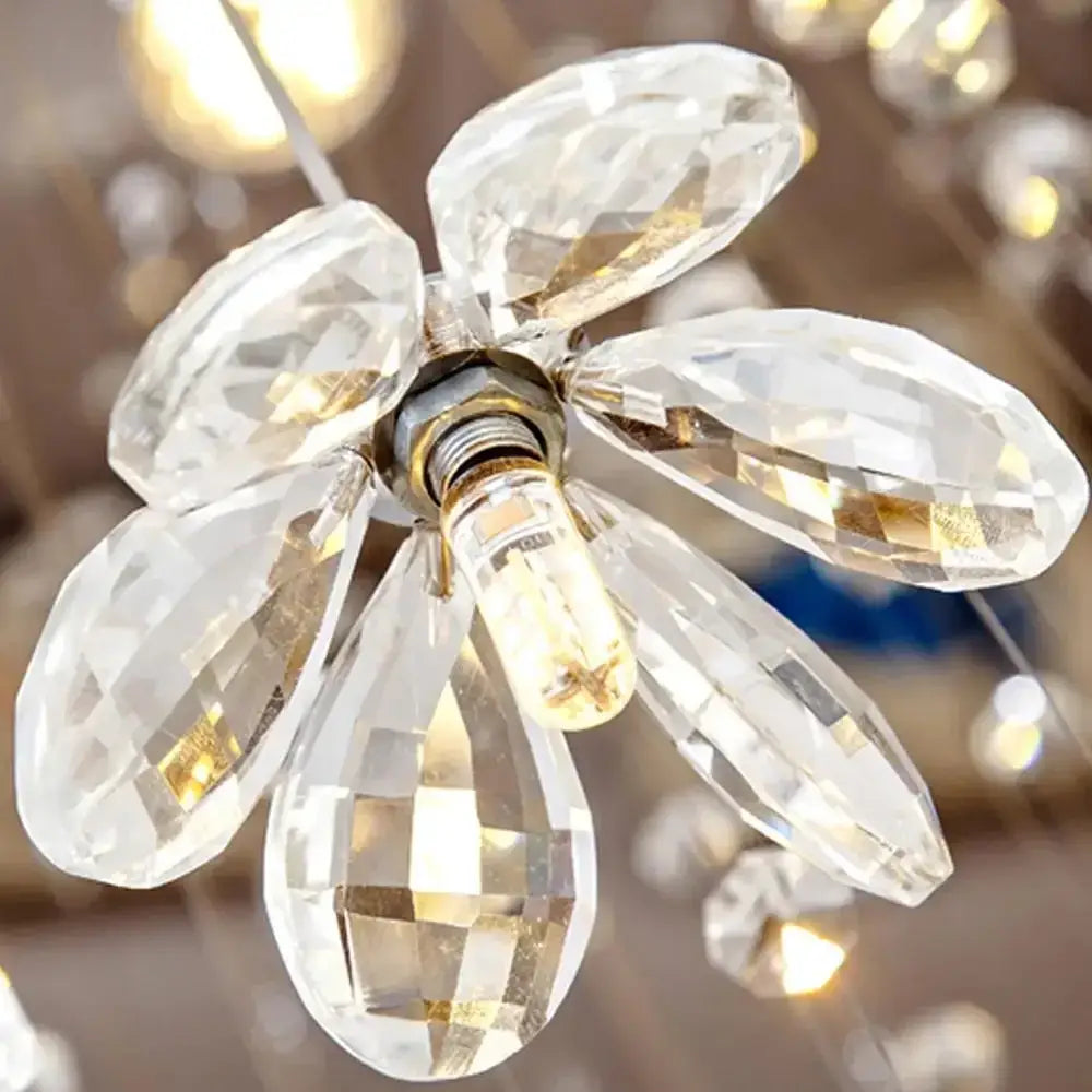 A clear faceted crystal hanging chandelier pendant with central bulb for modern multi-tiered decorbites crystal hanging use