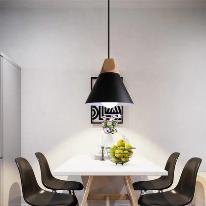 Black decorbites cone wood pendant light with wooden top accent hanging above white dining table