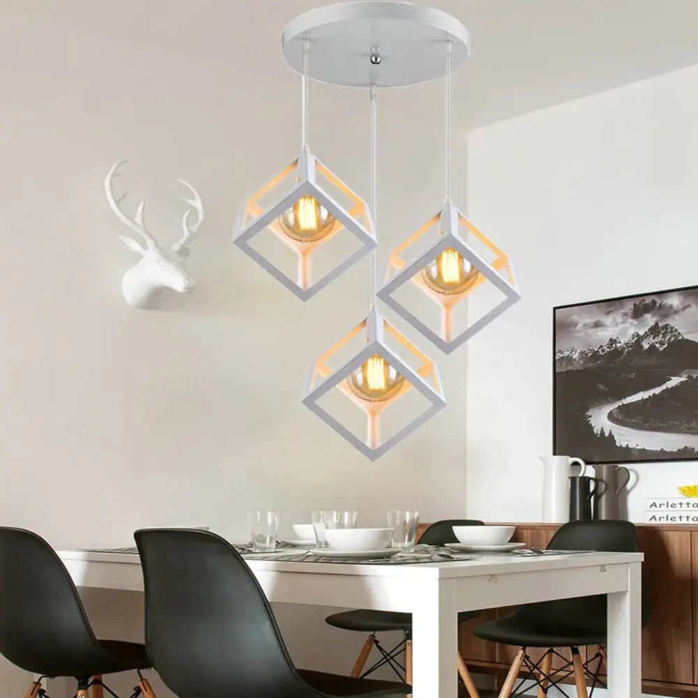 Modern white geometric cube pendant lights with warm glowing bulbs for kitchen decorbites geometric cube decor