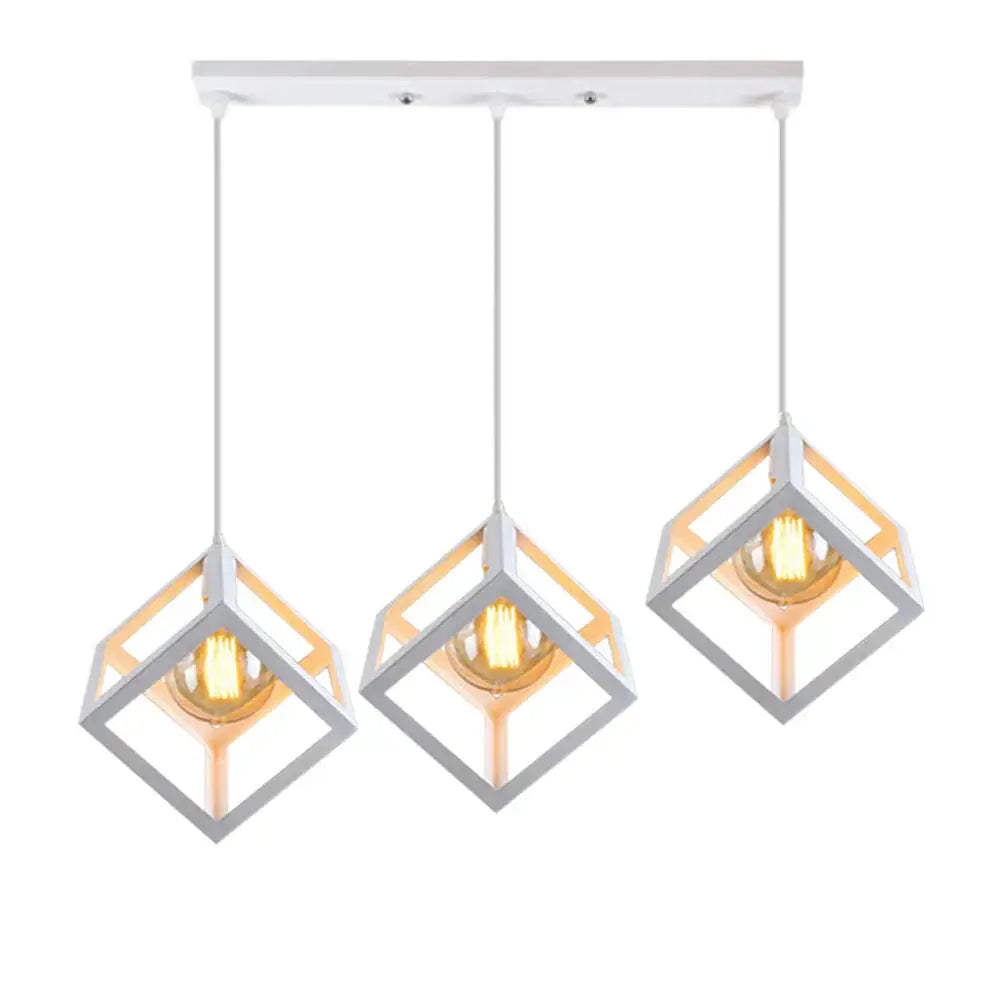 Modern white pendant lights set with three geometric cube shades featuring warm-toned bulbs for kitchen decorbites decor
