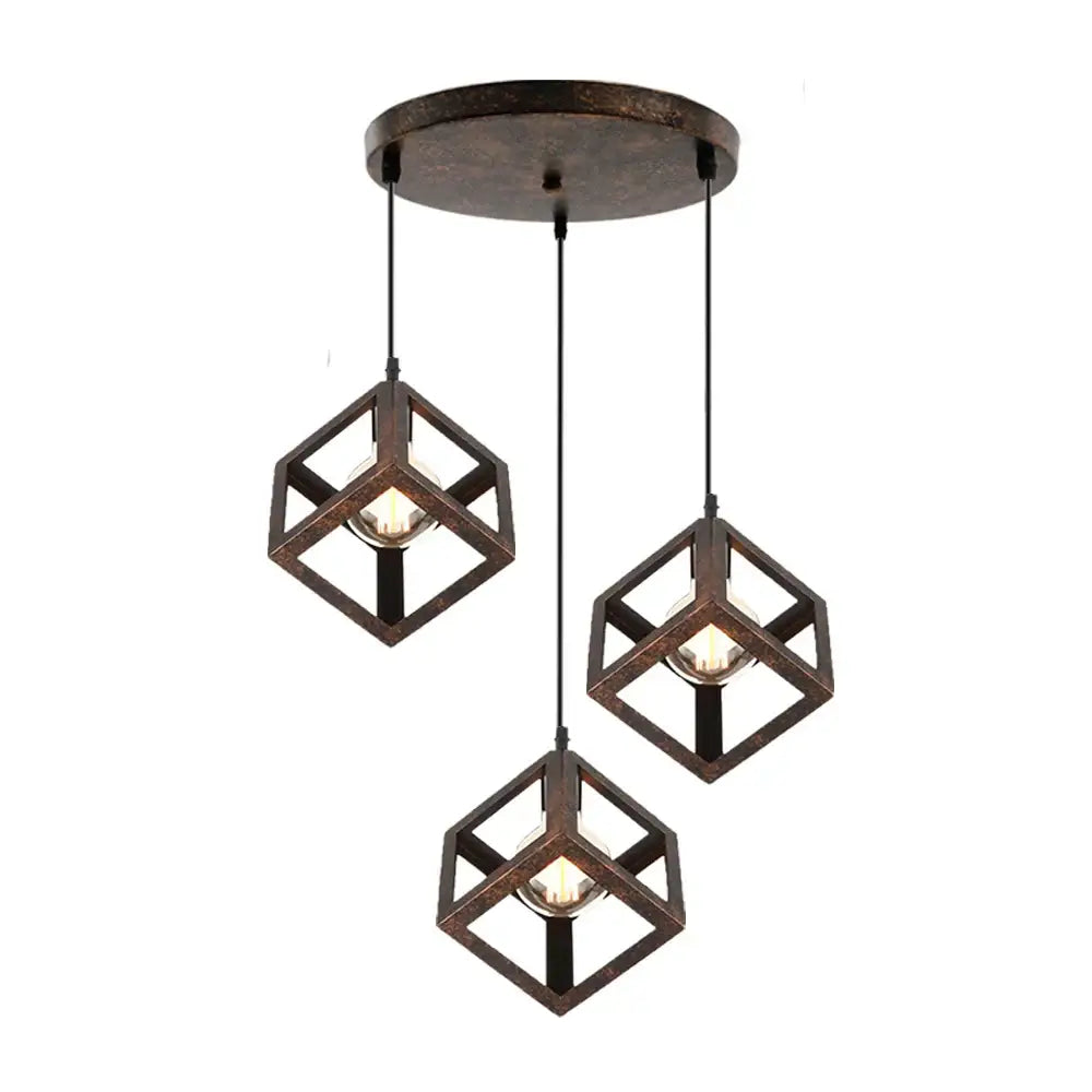 Set of three rustic bronze-finished geometric cube pendant lights with exposed bulbs perfect for modern kitchen decorbites geometric cube