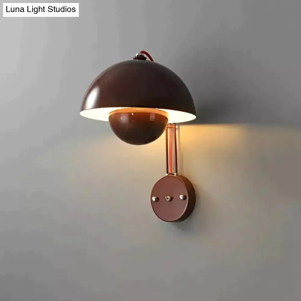 Brown metallic wall lamp with dome-shaped shade and brass base type featuring copper-toned accents for bedroom use