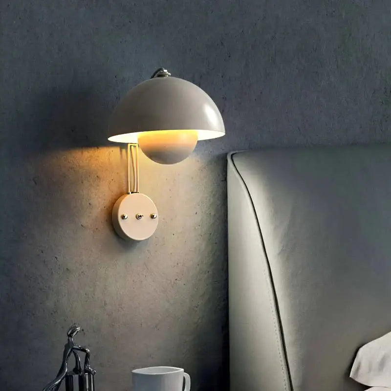 Modern mushroom wall lamp with matte white dome shade and brass base type finish for bedroom lighting