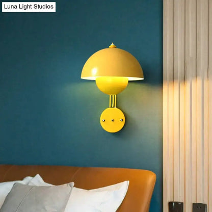 Vibrant yellow modern mushroom wall lamp with brass base type and sleek metallic finish for bedroom use