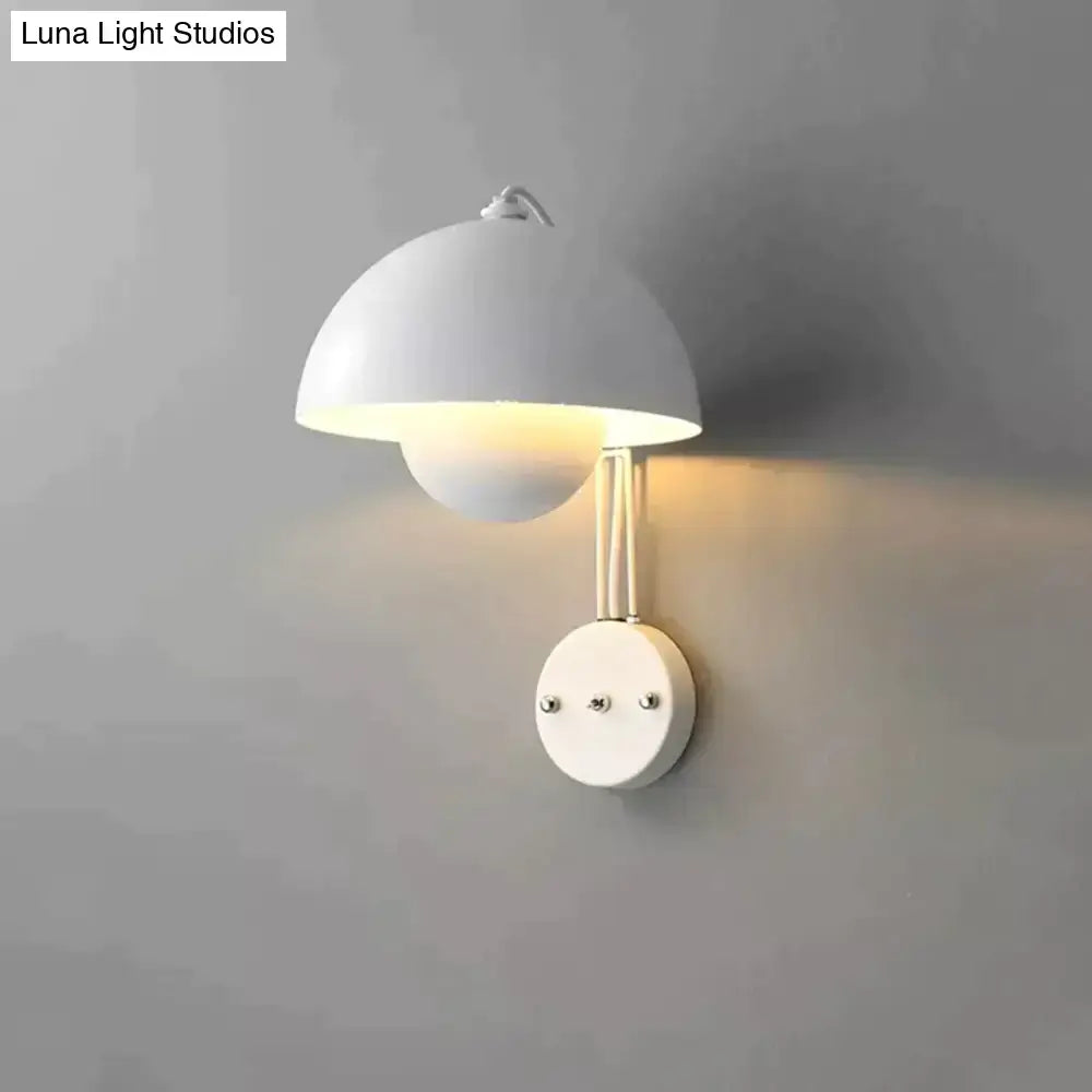 White minimalist wall lamp with dome-shaped shade and brass base type for modern bedroom lighting decor