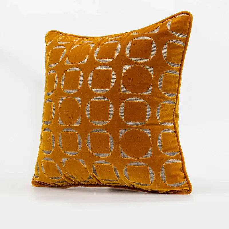 A mustard-yellow velvet pillow cover with silver metallic decorbites geometric jacquard pattern for living room decor