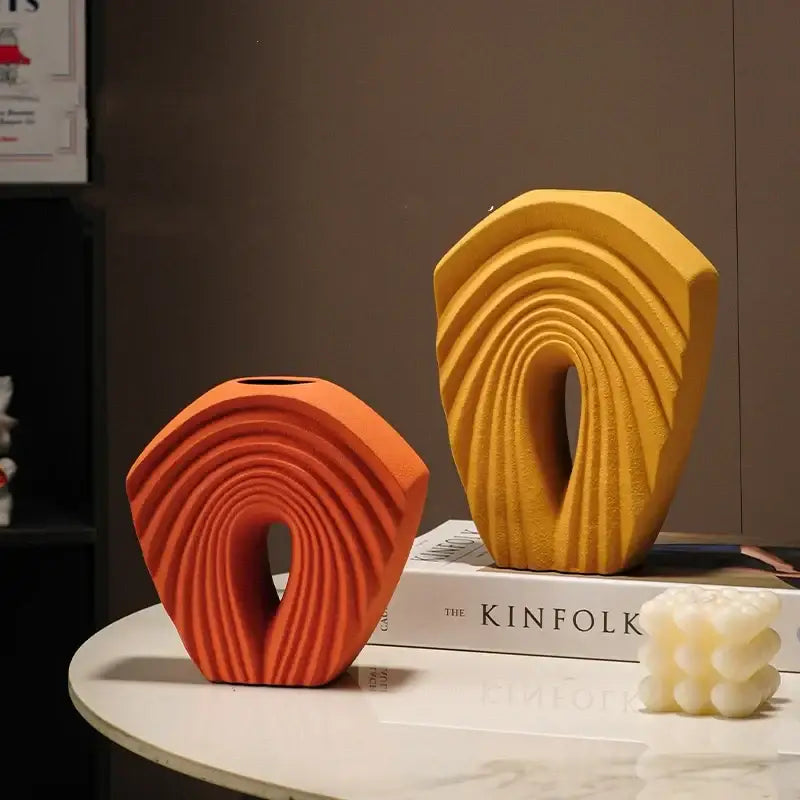 Modern mustard yellow and orange geometric folds ceramic vases with concentric ribbed designs for living room decor