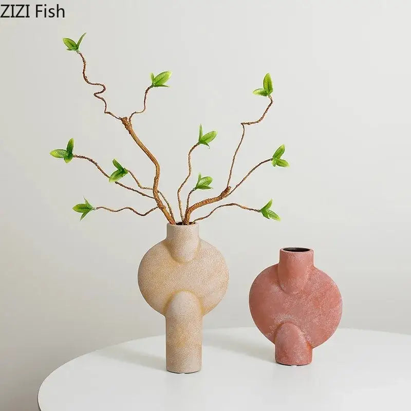 Beige and dusty rose decorbites ceramic disc vases with organic sculptural shapes for modern muted tones living room decor