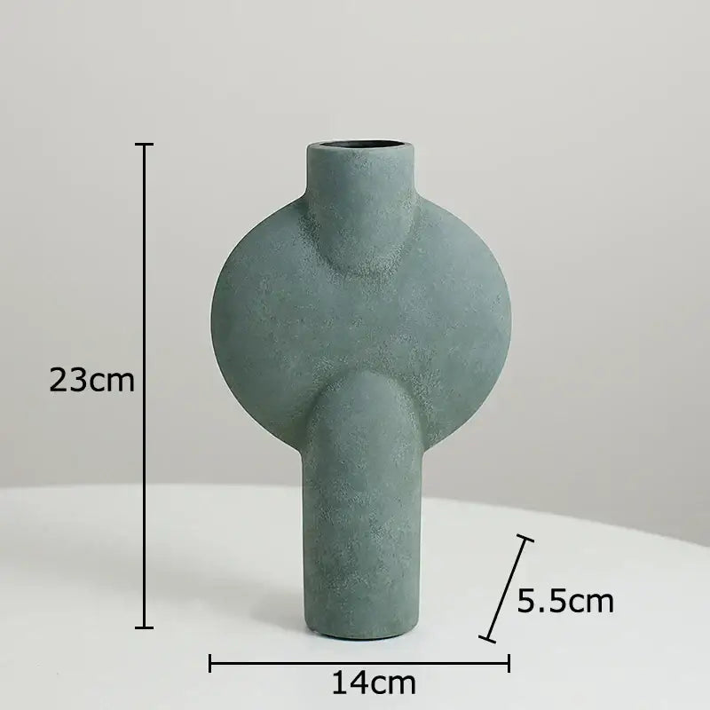 Modern muted tones ceramic disc vase set featuring a matte sage green decorbites ceramic disc vase with textured surface