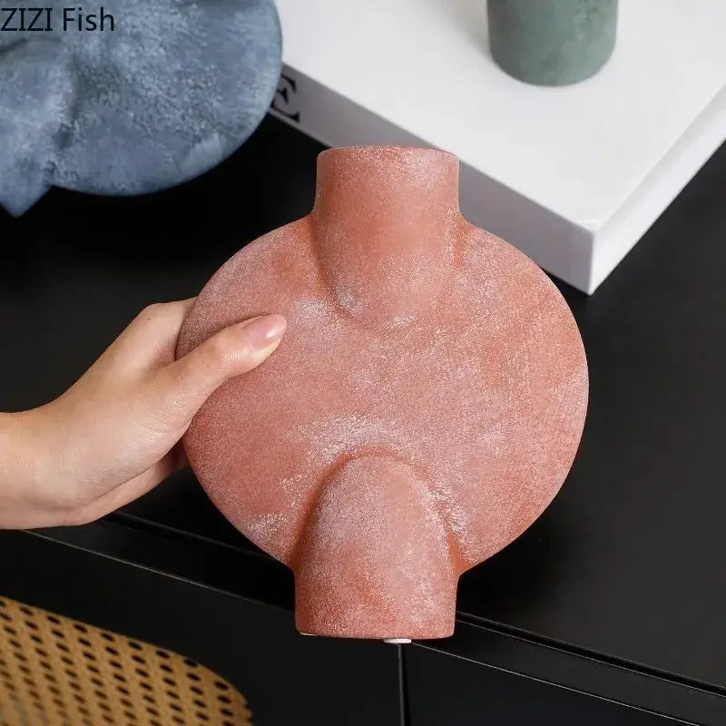 Modern terracotta decorbites ceramic disc vase with textured matte finish and abstract organic shape for living room decor
