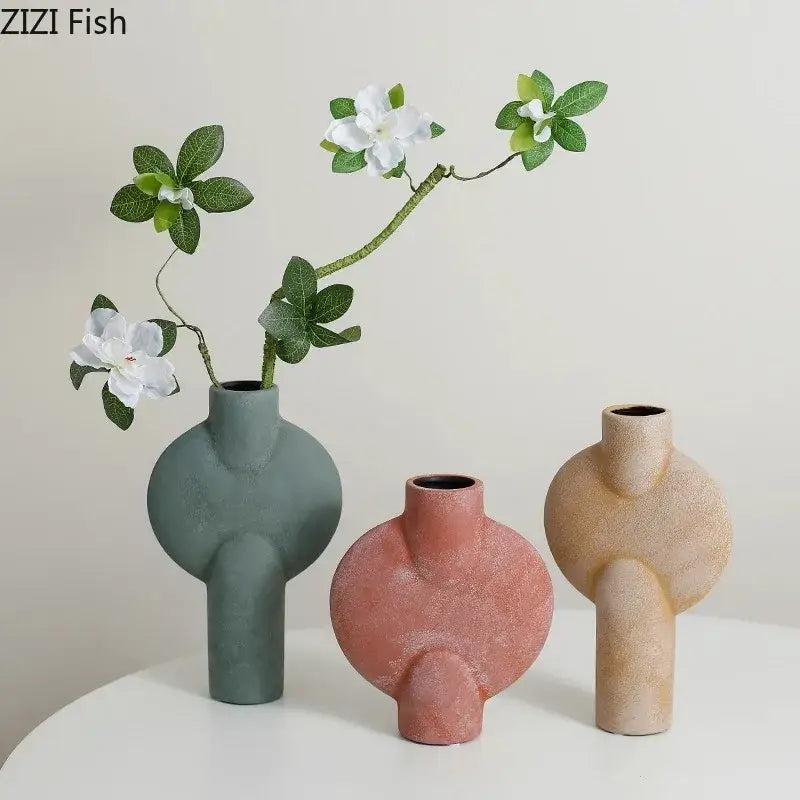 Modern muted tones ceramic disc vase set featuring three textured ceramic disc vases in green terracotta and beige decorbites ceramic