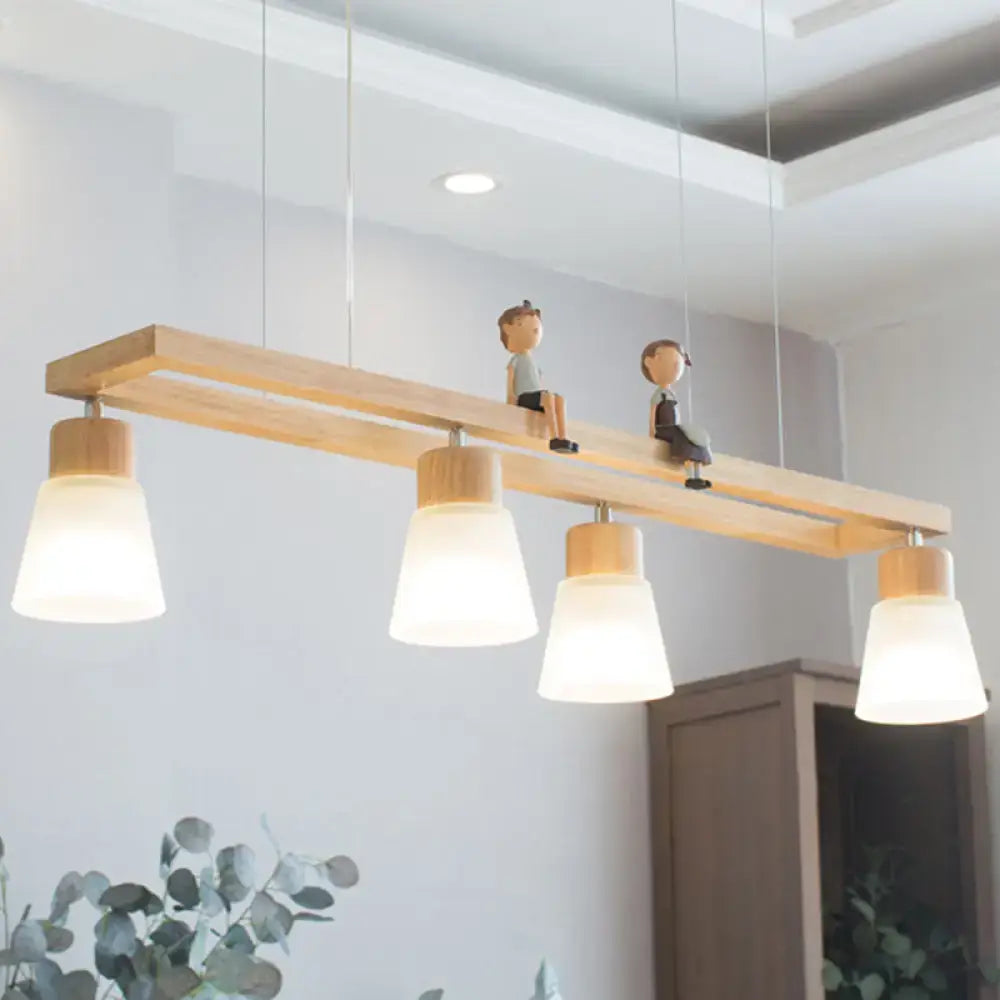 Modern natural wood rectangle island pendant light with four frosted glass shades and small wooden figurines mounted on bar