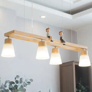 Modern natural wood rectangle island pendant light with four frosted glass shades and small wooden figurines mounted on bar