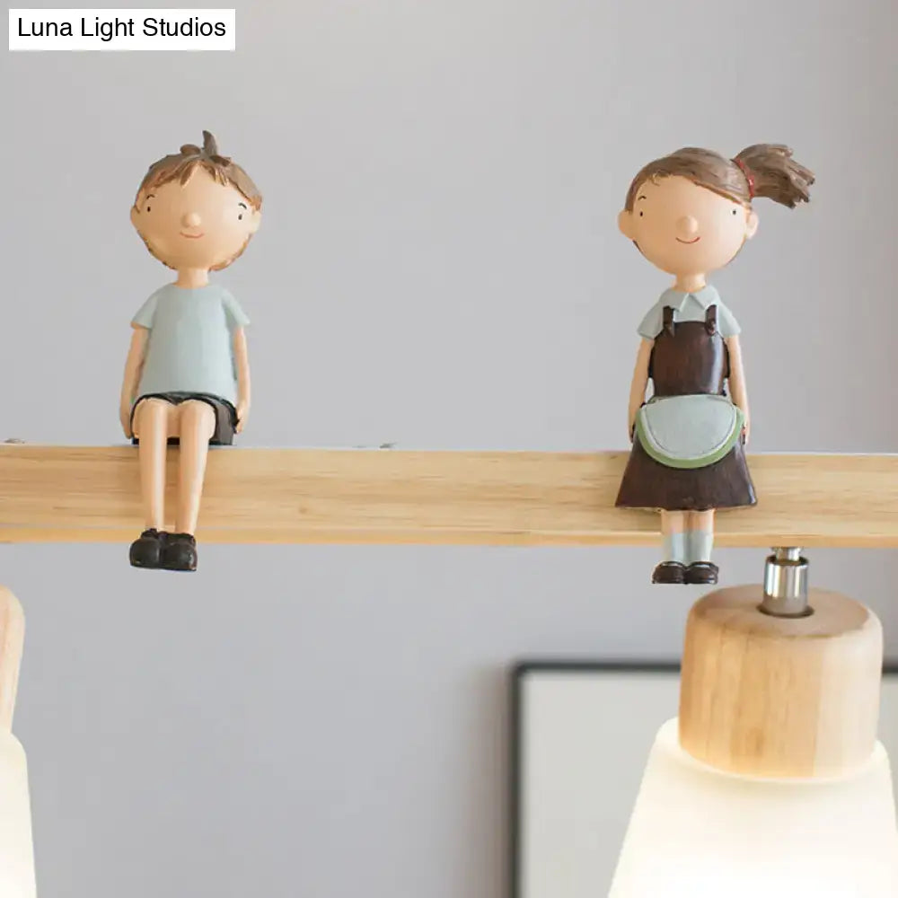 Modern natural wood rectangle island pendant light with cute wooden boy and girl figurines in school uniforms sitting on shelf