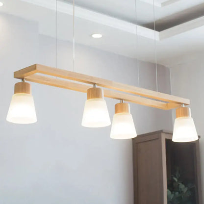 Modern natural wood rectangle island pendant light with four frosted glass shades and natural wood accents for pendant lighting