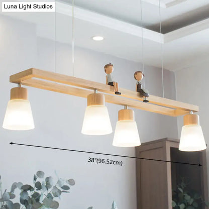 Modern natural wood rectangle island pendant light with four frosted glass shades and figurine accents for kitchen pendant lighting