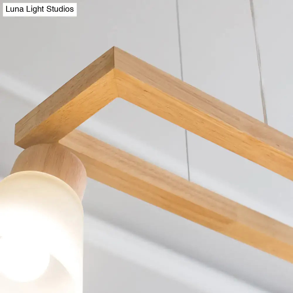 Modern natural wood rectangle island pendant light with warm wood frame and frosted glass shade for pendant lighting