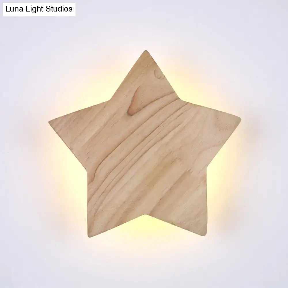 A warm glowing modern natural wood star wall lamp with visible grain designed for living room sconce lighting