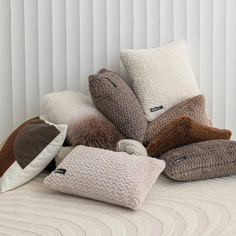 A cozy collection of modern neutral geometric texture plush cushion covers in beige taupe and brown for living room decorbites