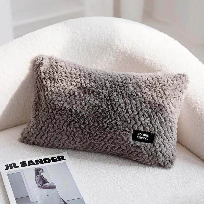 A cozy gray faux fur cushion cover with a black no one empty patch featuring decorbites geometric texture plush design