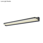 Modern nickel finish led vanity sconce with black frame, elongated design, and frosted glass diffuser for bathroom walls
