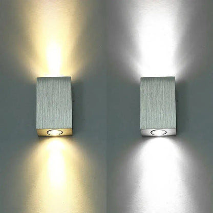 Modern nickel finish rectangular led wall sconce with brushed silver finish and circular led light at the base