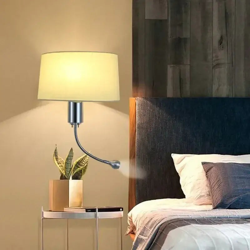 A sleek modern wall lamp with a curved metallic arm and beige decorbites elegant fabric shade for bedroom reading light