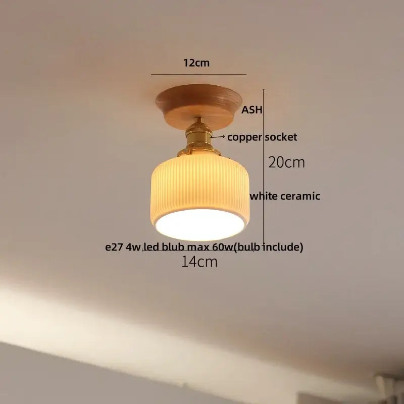 A warm-toned ceiling lamp with a wooden ash base copper socket and white ceramic shade by decorbites clear glass led