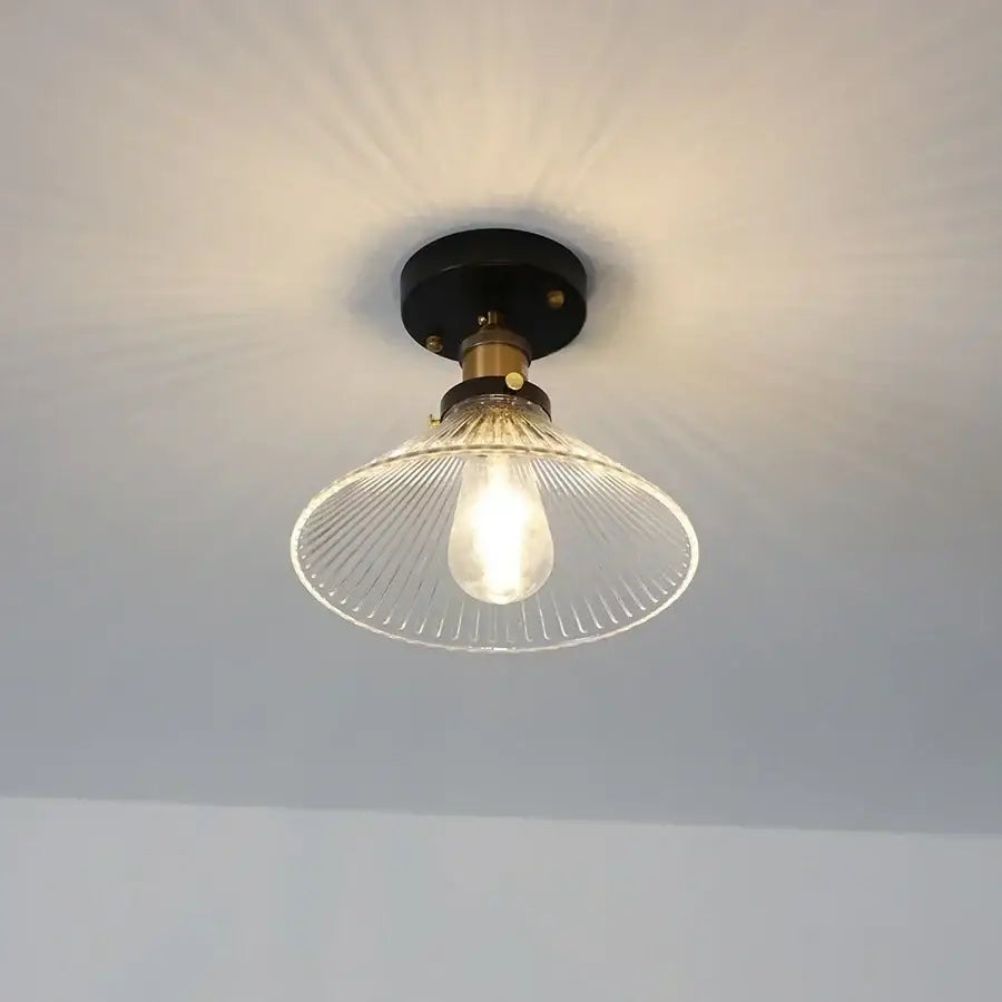 Modern nordic ceiling lamp with decorbites clear glass led shade featuring ribbed glass and brass black metal base