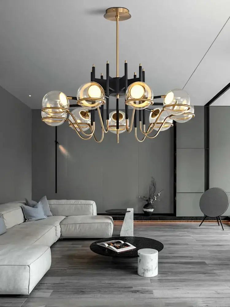 Modern nordic pendant light with gold-toned arms and decorbites clear glass ball shades in black structure