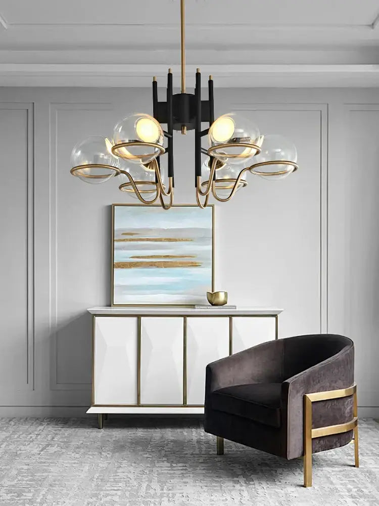 Modern nordic pendant light with black frame gold-toned arms and clear glass ball shades decorbites clear glass design