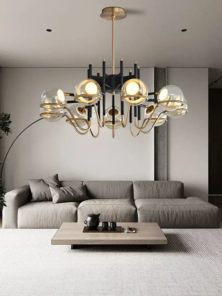 Modern nordic pendant light with gold-toned metal arms and decorbites clear glass clear glass ball globes