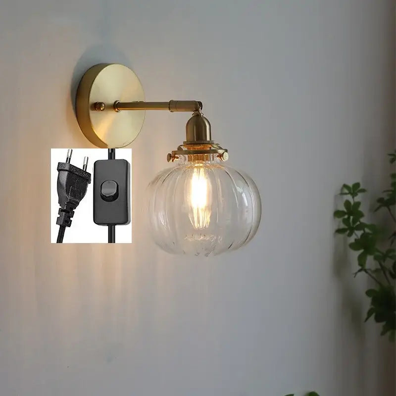 Modern nordic brass glass ball wall lamp with a ribbed glass globe and exposed filament bulb for decorbites glass ball wall decor