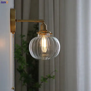 Modern nordic brass glass ball wall lamp with ribbed clear glass globe and exposed filament bulb for bedroom decorbites glass ball