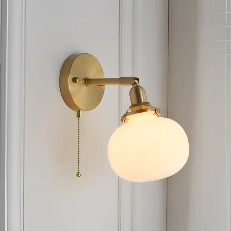 Modern nordic brass glass ball wall lamp with gold-toned adjustable arm and frosted glass globe for decorbites glass ball decor