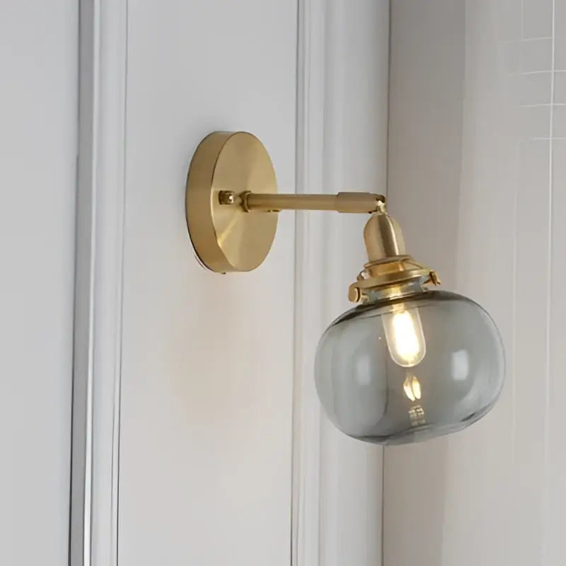Modern nordic brass glass ball wall lamp with frosted glass globe and gold-toned brass hardware for bedroom decorbites glass ball