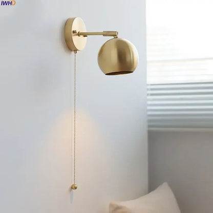 Modern nordic brass-finished spherical copper wall light with pull-chain switch and decorative ball for bedroom decorbites copper wall light