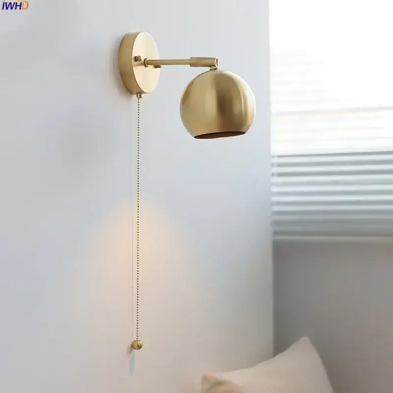 Modern nordic brass-finished spherical copper wall light with pull-chain switch and decorative ball for bedroom decorbites copper wall light