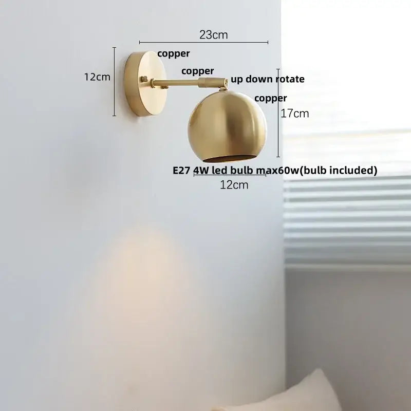 Modern nordic copper wall light with a brushed copper finish, spherical shade, adjustable arm, and pull chain switch