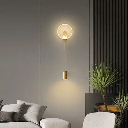 Modern nordic gold led wall light featuring a gold-toned circular wall lamp with a cylindrical pendant decorbites gold led