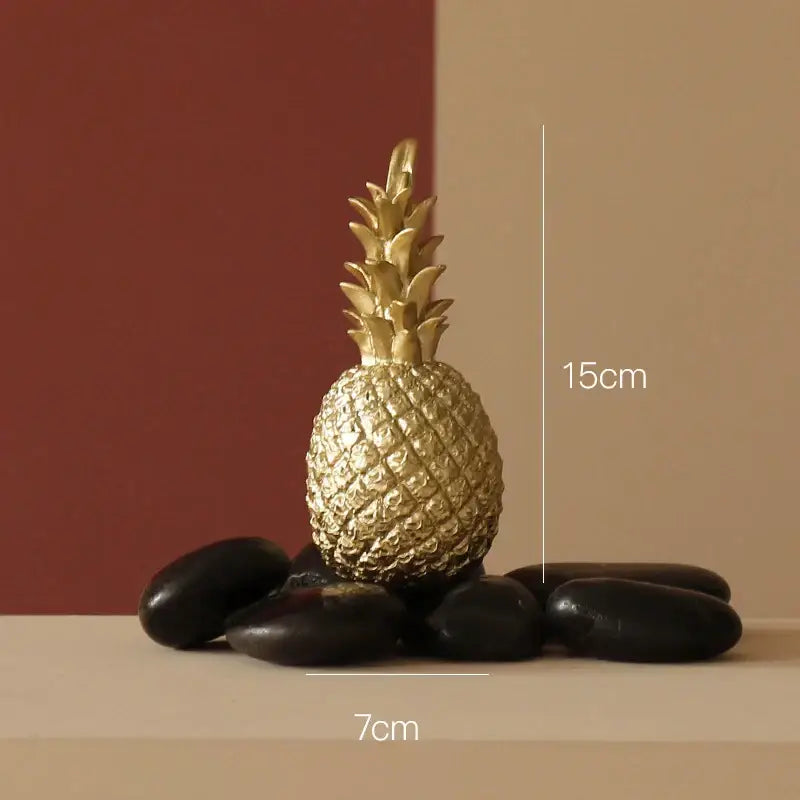Modern nordic decorbites golden pineapple figurine with textured metallic surface and leafy crown for living room decor