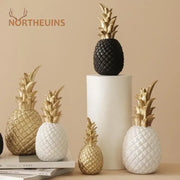Modern nordic gold and white golden pineapple figurine with textured diamond pattern and metallic gold leaf crown by decorbites golden pineapple decor