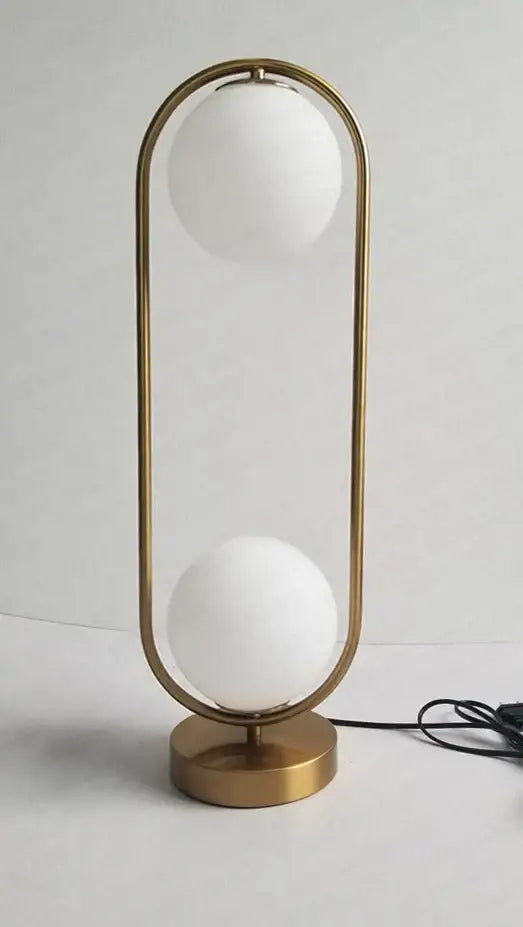 Modern nordic golden body glass led desk lamp with frosted globes in a sleek curved frame for bedroom decorbites golden body