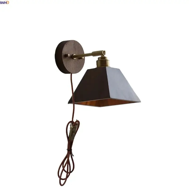 Modern nordic gray and walnut led wall sconce with dark gray metal lampshade, brass arm, and copper interior decorbites led wall