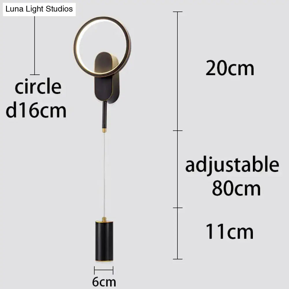 Modern nordic led wall lamp in black gold with adjustable hanging length and circular design for bedroom sconce use