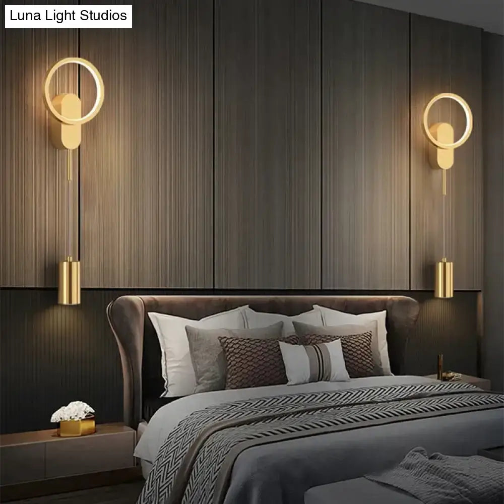 Modern nordic led wall lamp featuring gold-toned circular sconces with sleek cylindrical hanging elements in black gold