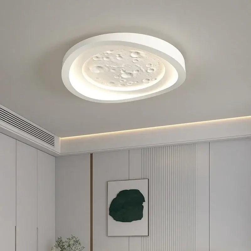 Modern nordic white led ceiling lamp with textured moon surface featuring raised bumps for bedroom lighting