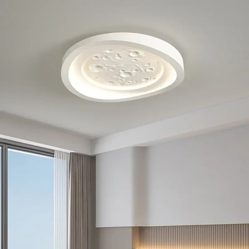Modern nordic moon surface white led ceiling lamps with textured bubble pattern and soft glowing illumination for bedrooms