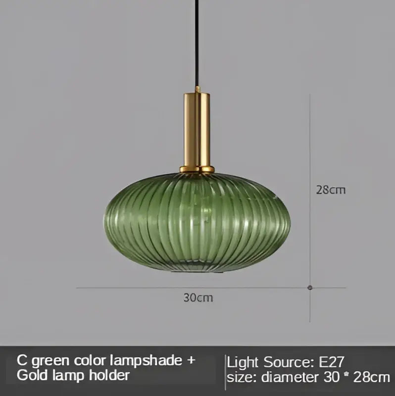 Modern nordic pendant lights featuring a green ribbed glass led glass led pendant with a gold metal holder for dining room